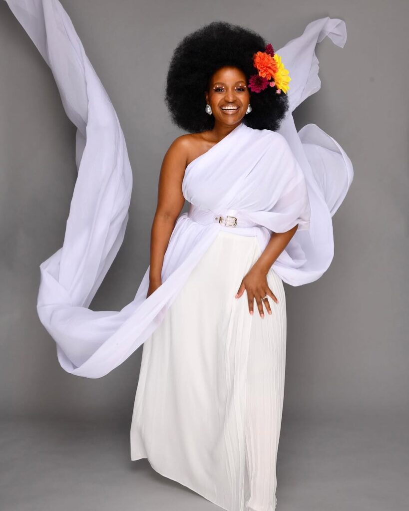 Grace Msalame looks angelic in a white dress. Photo: Instagram